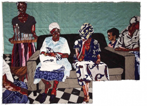 Left to right - Black woman holds tray of glasses and bottle of water. Two blakc women sit on the couch. Black child looks towards women on couch. Black person looks away to the right. Background looks like a quilt in a shade of green. Black and white checkered floor.