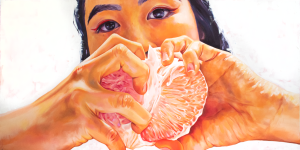 A painting of a woman who is ripping apart a pomelo