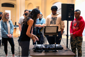 Kelli-Smith Biwer shows a group of students how to use the technology from the Beat Lab