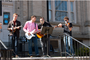 Four members on the Carolina Bluegrass Band perform on the steps of Hill Hall