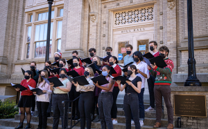 Carolina Chamber Singers sings on the steps of Hill Hall